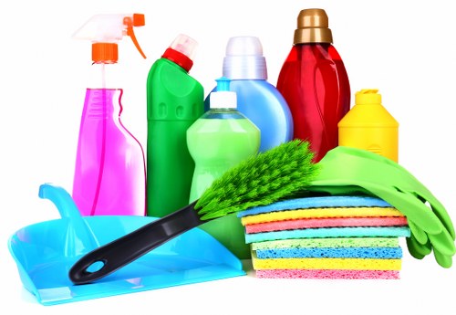 Professional cleaner in Docklands maintaining a modern apartment