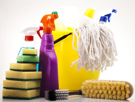 Technician wearing PPE during a Docklands carpet cleaning task